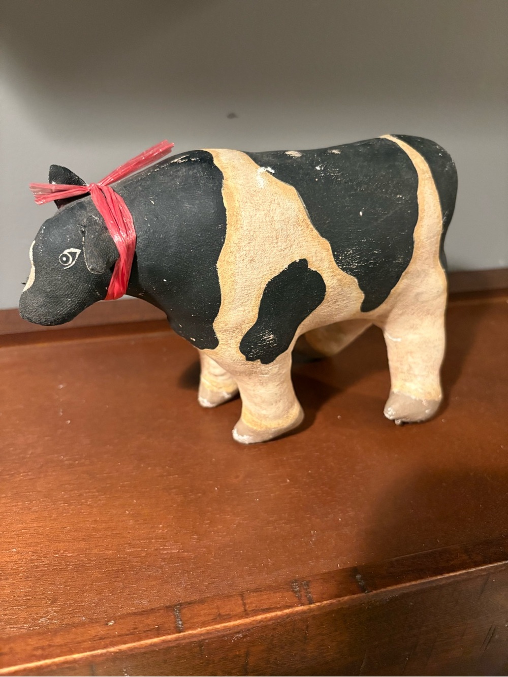 Vintage Hand painted CanvasCow Figurine in Black and Tan with Red Bow